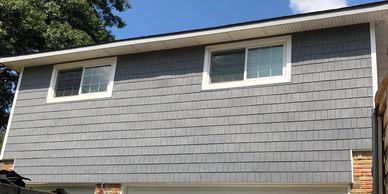 House exterior with newly installed grey siding